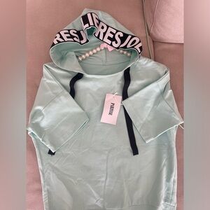 Shirt with hood , small/medium size . Never used